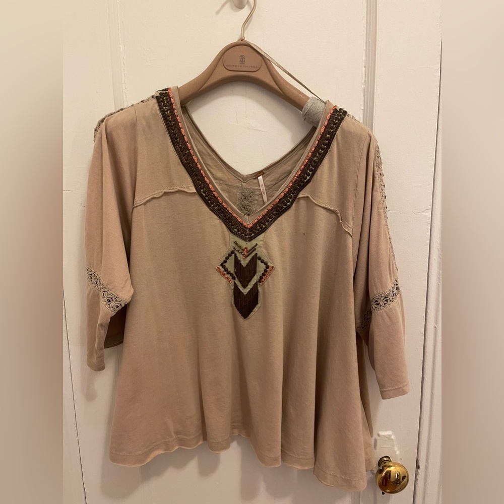 Free people tunic in beige color. Never worn brand news without tag.